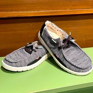 Brand new women’s Hey dude slip on shoes.